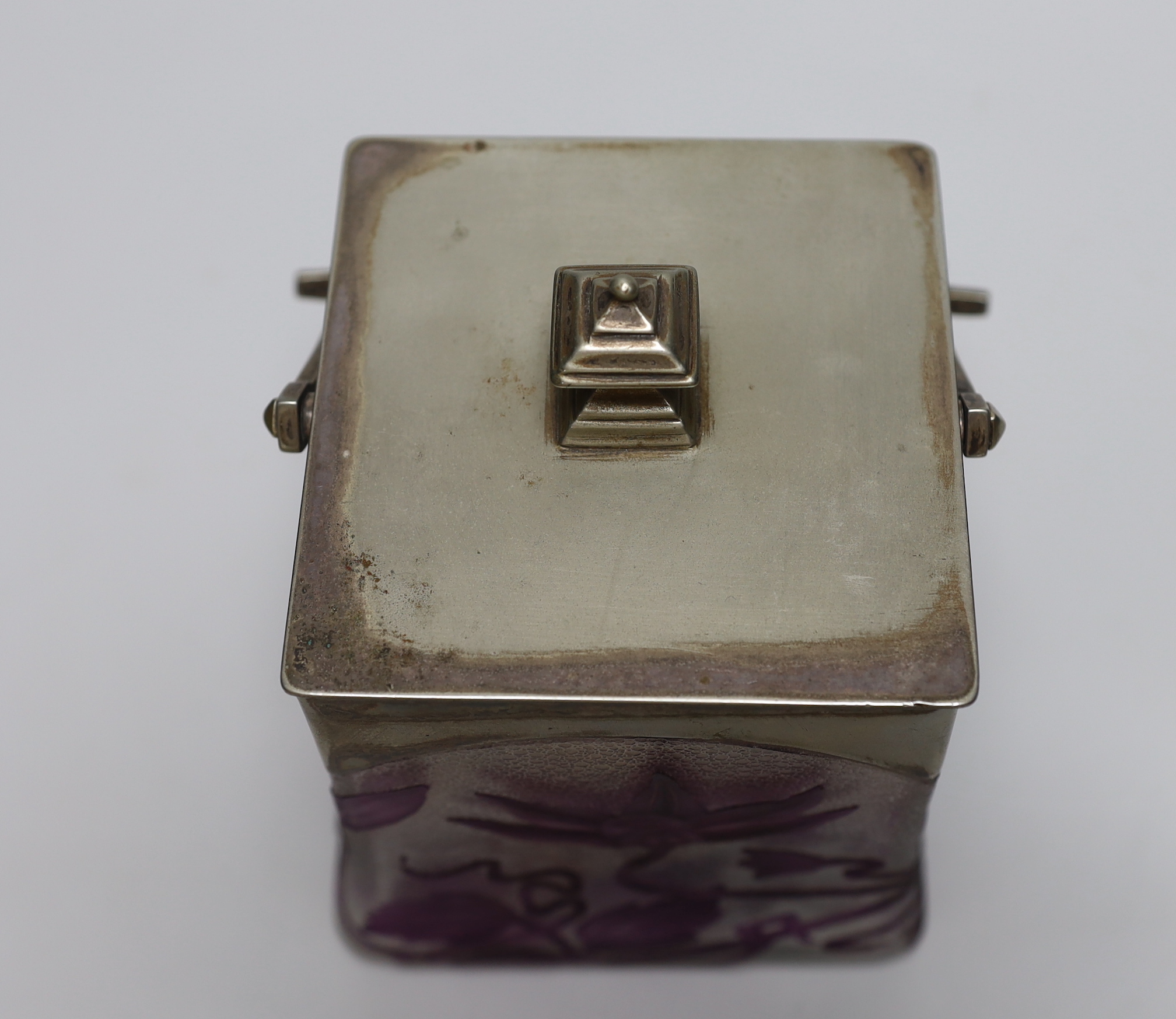 A Bohemian Art Nouveau cameo glass biscuit box, acid etched with sinuous plants in amethyst, against a frosted ground, plated mounted, with a lid, 16cm